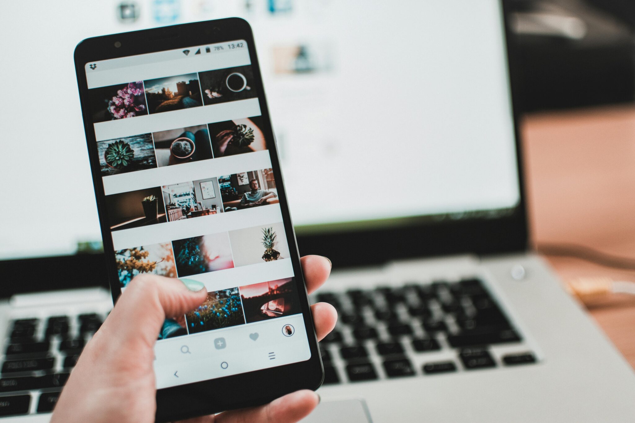 a person selecting images on their mobile phone